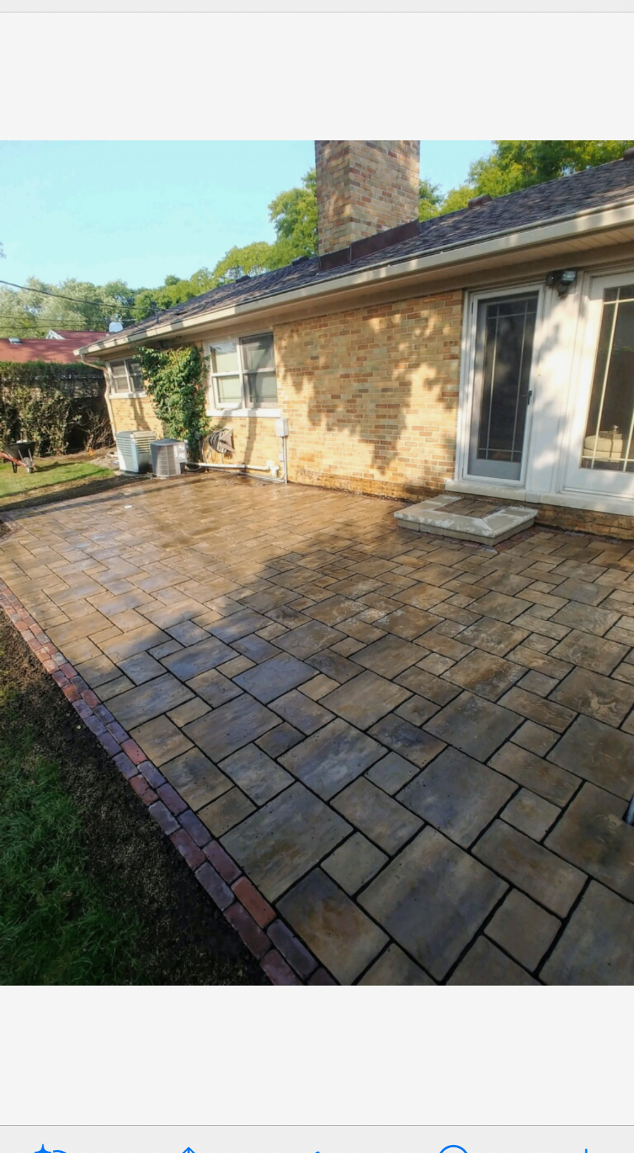 Paver patio installation in a residential backyard
